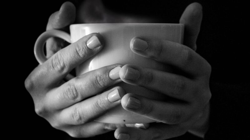 Hands holding a cup of tea