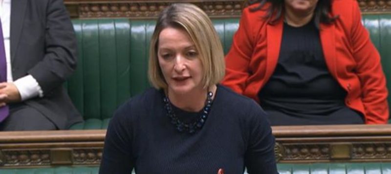 Jessica Morden MP in Parliament on December 20th 2022. Jessica is wearing a blue dress and behind her are the green benches of the House of Commons.