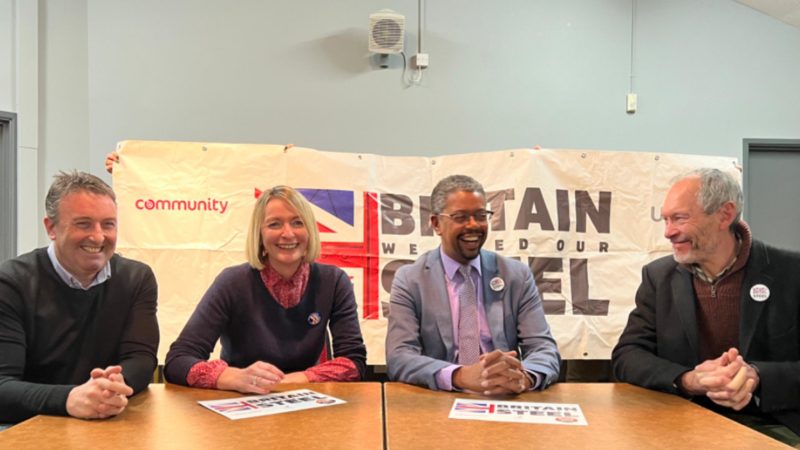 Jessica Morden sat around a table with Rob Edwards to her right, and Vaughan Gething and John Griffiths to her left. Behind them is a banner  that reads "Britain needs it steel"