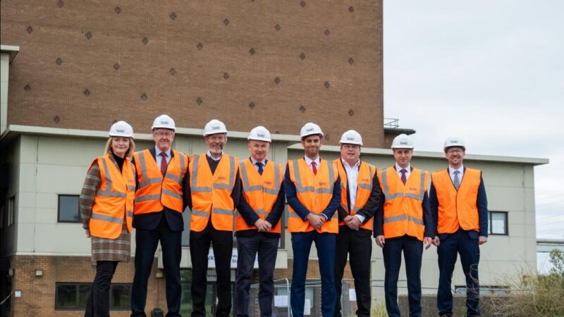Jessica Morden stands with members of the team from SAE, John Griffiths MS, and Councillors Dimitri Batrouni and James Clarke at the Uskmouth SAE site